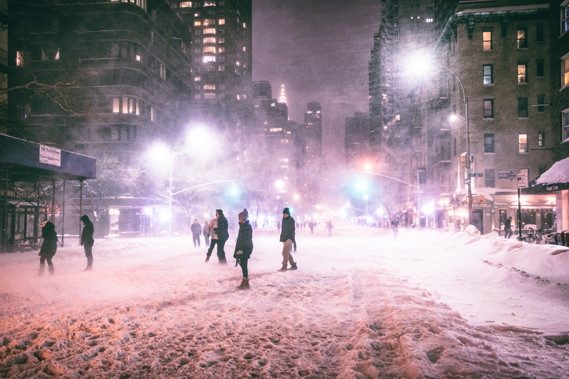 NYC Skincare Tips for Dry Winter Skin: A Hydrating Routine for Real City Life 11 Woman with soft glowing skin walking in NYC winter.