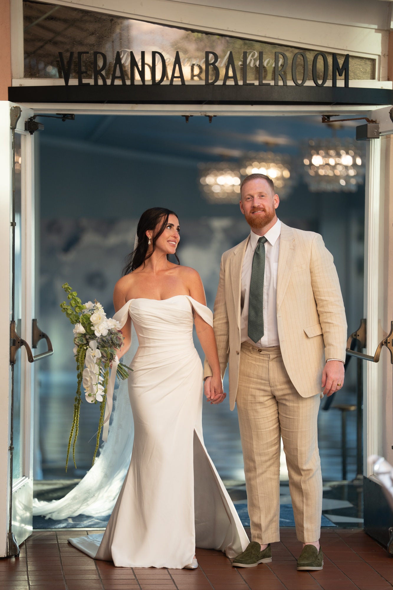 Bride and groom walking into Veranda Ballroom Bride and groom walking into Veranda Ballroom