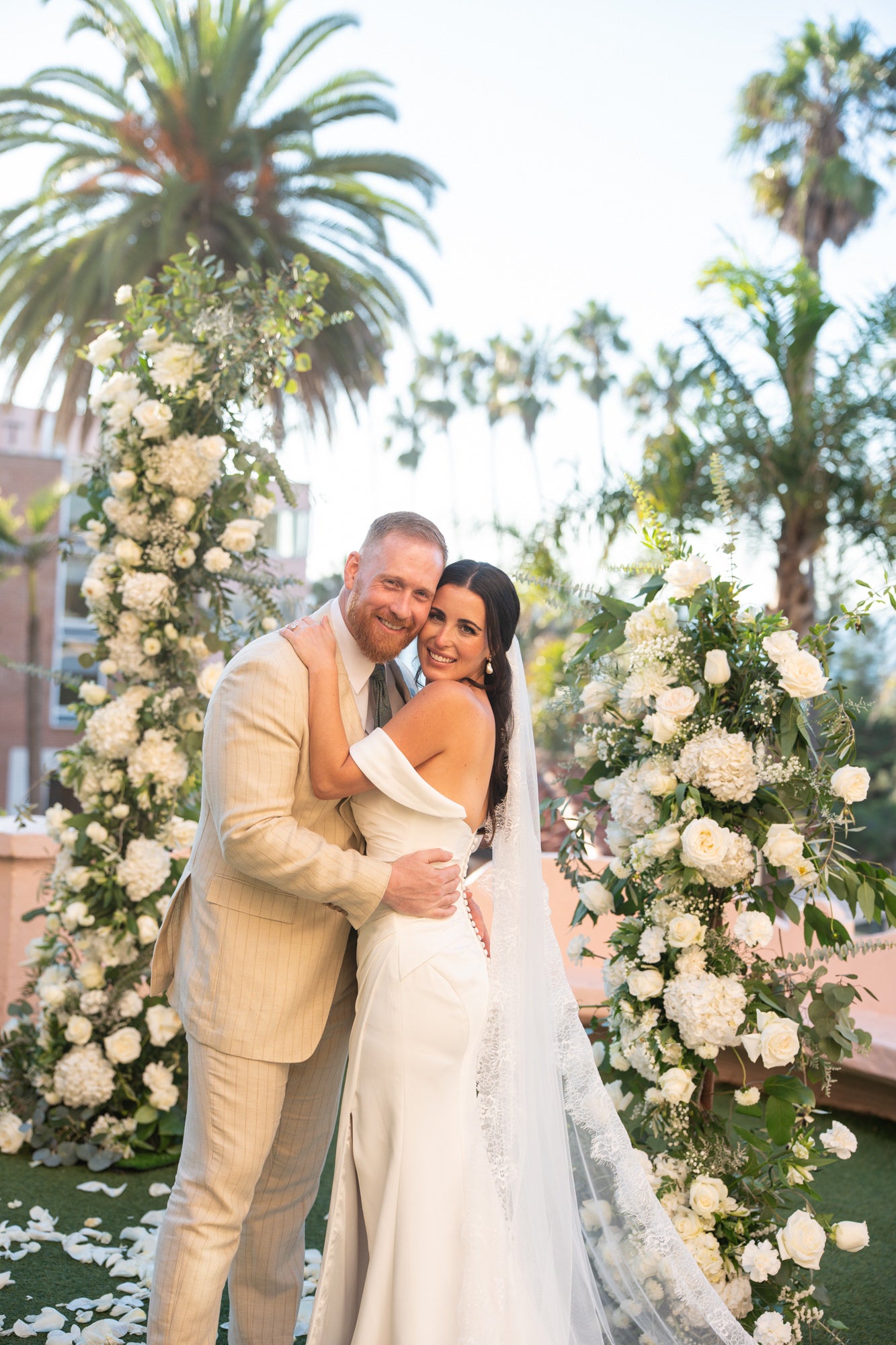 Groom and bride in front of flowers Groom and bride in front of flowers