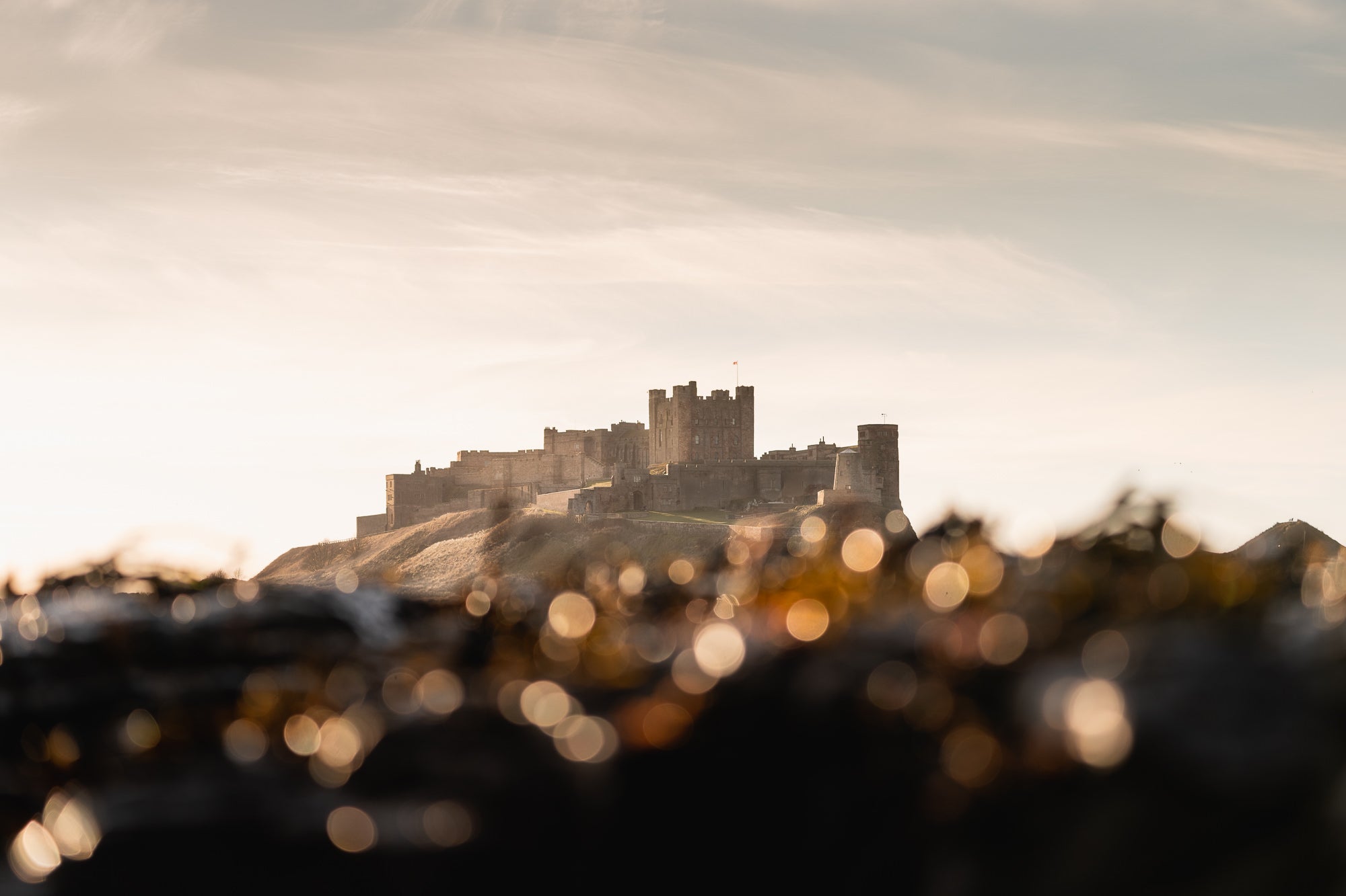 “Bamburgh Bokeh, using the telephoto compress the scene and create some foreground bokeh.” Photo by Daryl Scott Walker. Sony Alpha 7 III. Sony 100-400mm f/4.5-5.6 G Master. 1/800-sec, f/4.5, ISO 160