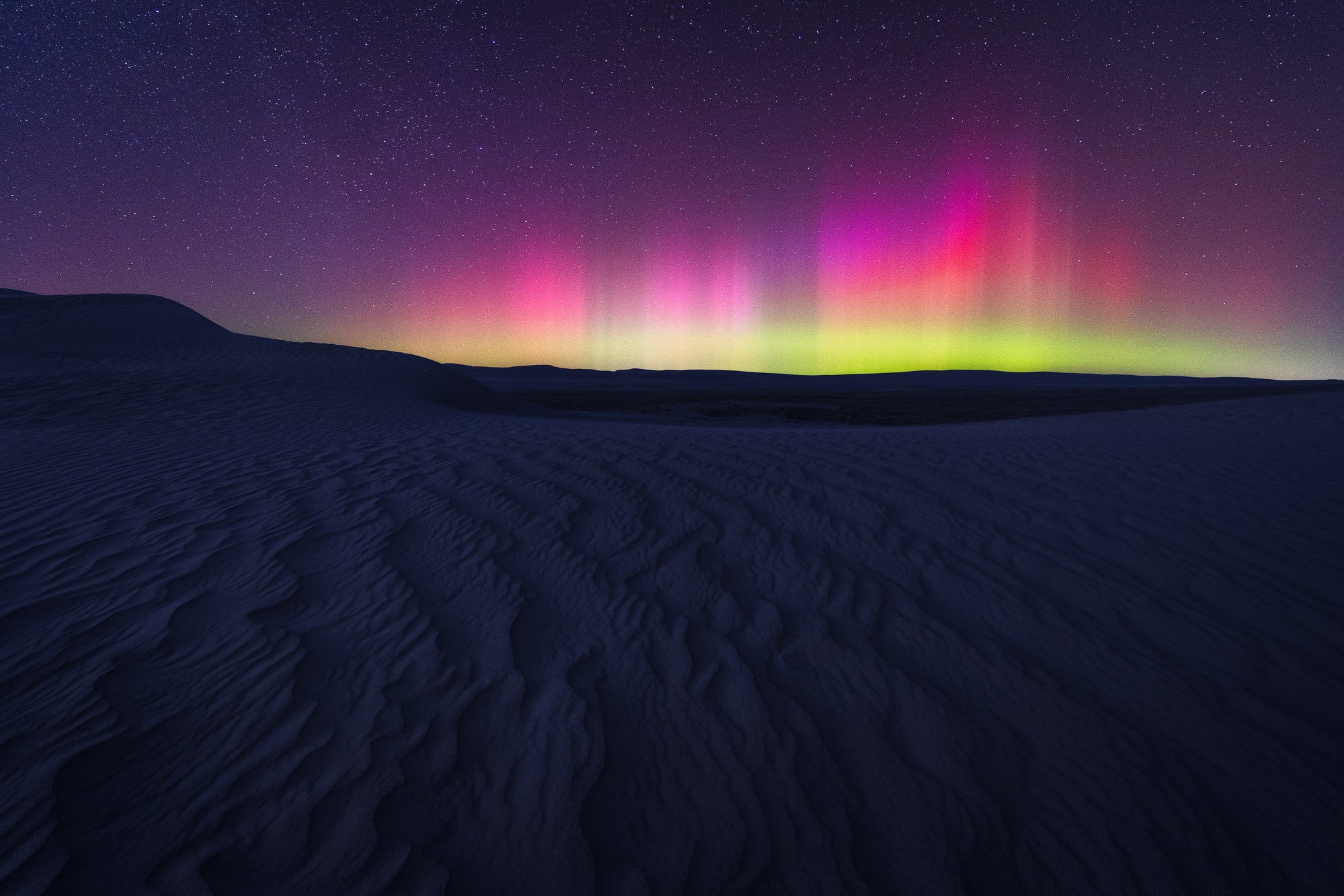 The Northern Lights above some sand dunes in eastern Washington State. Photo by Dylan McMains. Sony Alpha 7 III. Sony 16-35mm f/2.8 G Master. 10-sec., f/2.8, ISO 3200