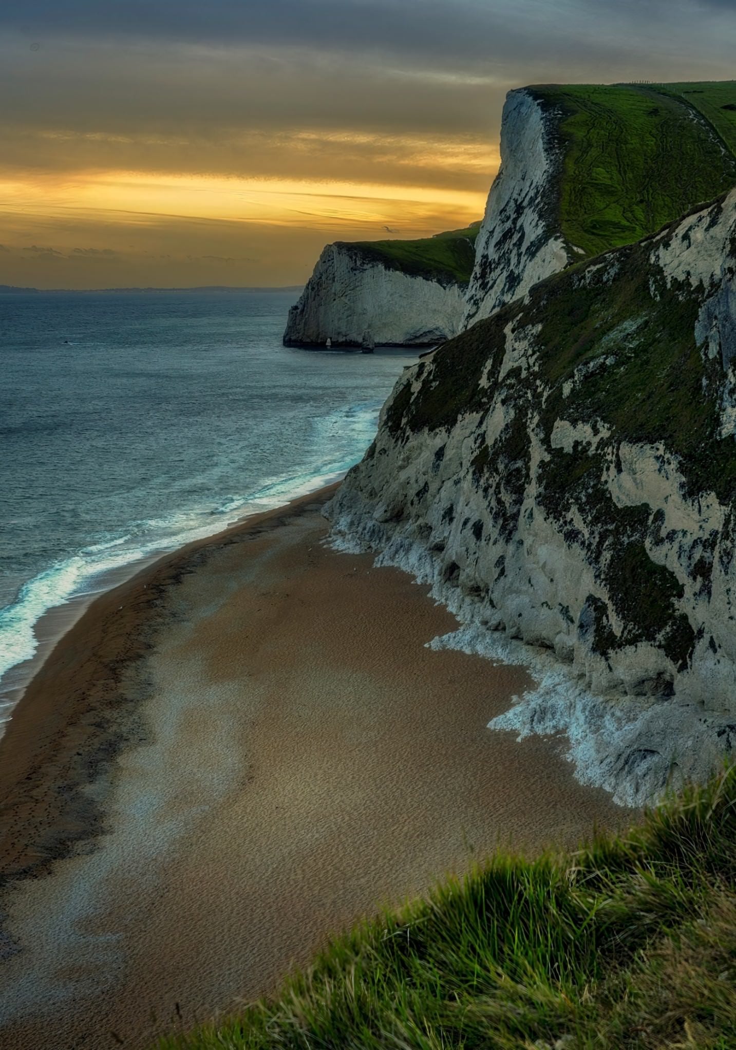 “Golden hues embrace the ancient cliffs along the stunning Jurassic Coast in England.” Photo by Raj Bose. Sony Alpha 7R IV. Sony 24-105mm f/4 G. 1/15-sec., f/10, ISO 160