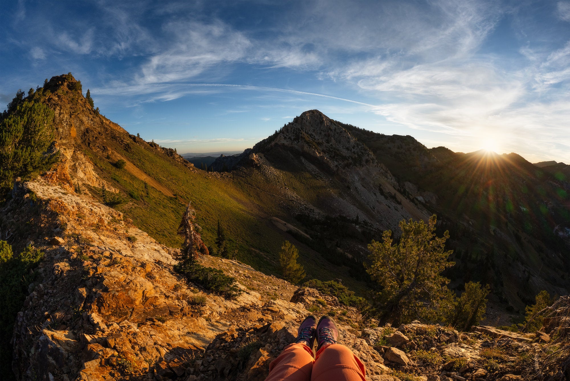 First-person view of a rocky mountain ridge at sunset, photographed by Autumn Schrock.