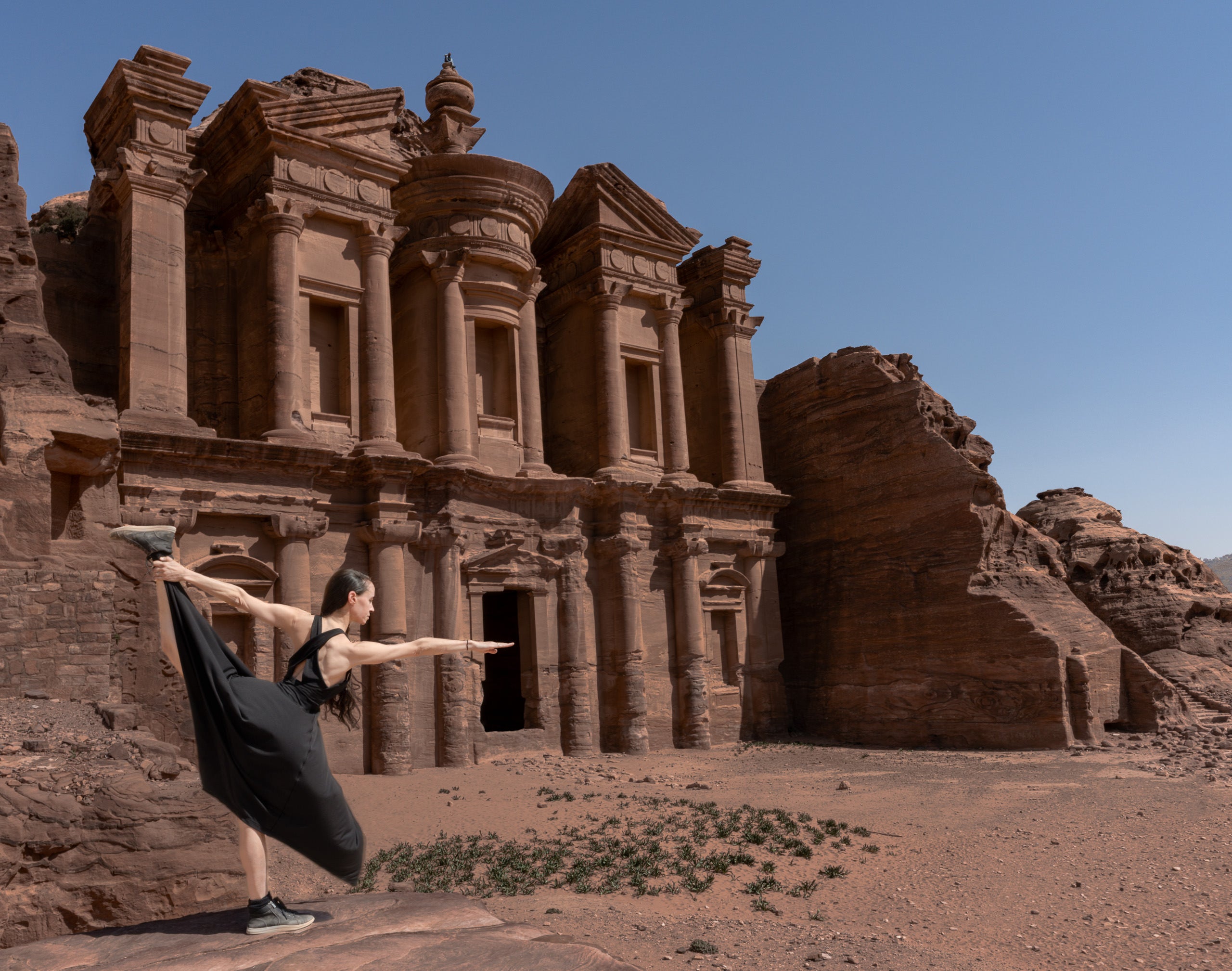 Woman doing yoga pose in Petra Woman doing yoga pose in Petra