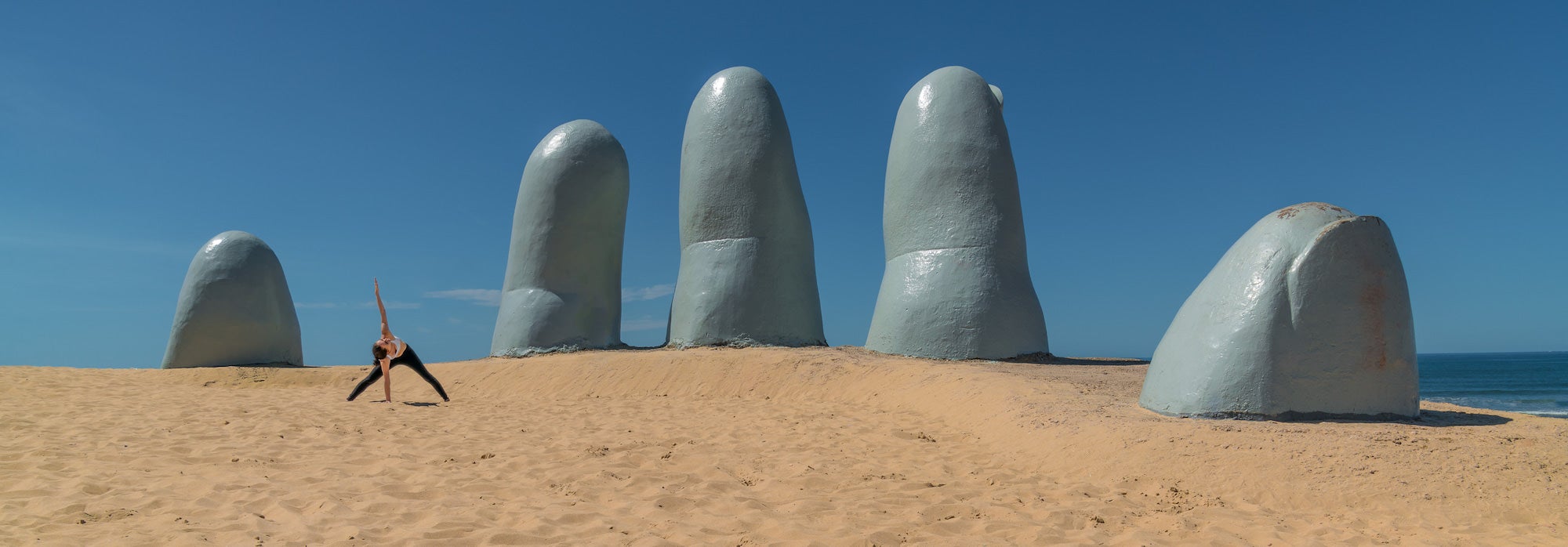Woman doing yoga pose in Punta del Este Uruguay Woman doing yoga pose in Punta del Este Uruguay