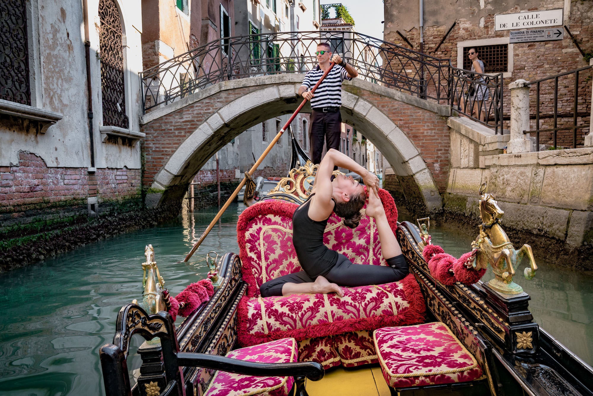 Woman doing yoga pose in Venice, Italy Woman doing yoga pose in Venice, Italy