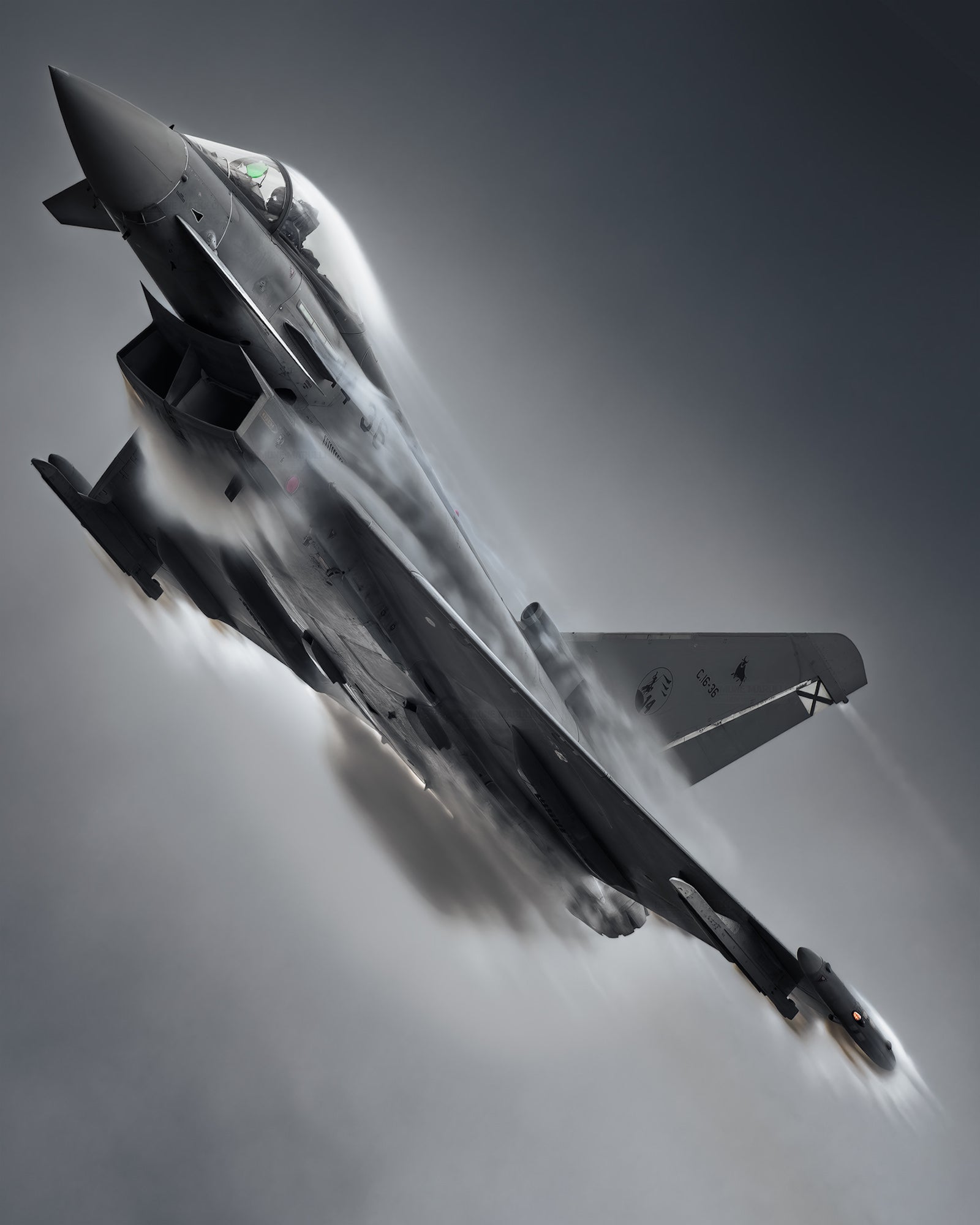Fighter jet pulls up hard, condensation clouds billowing over the wings in a moody gray sky.