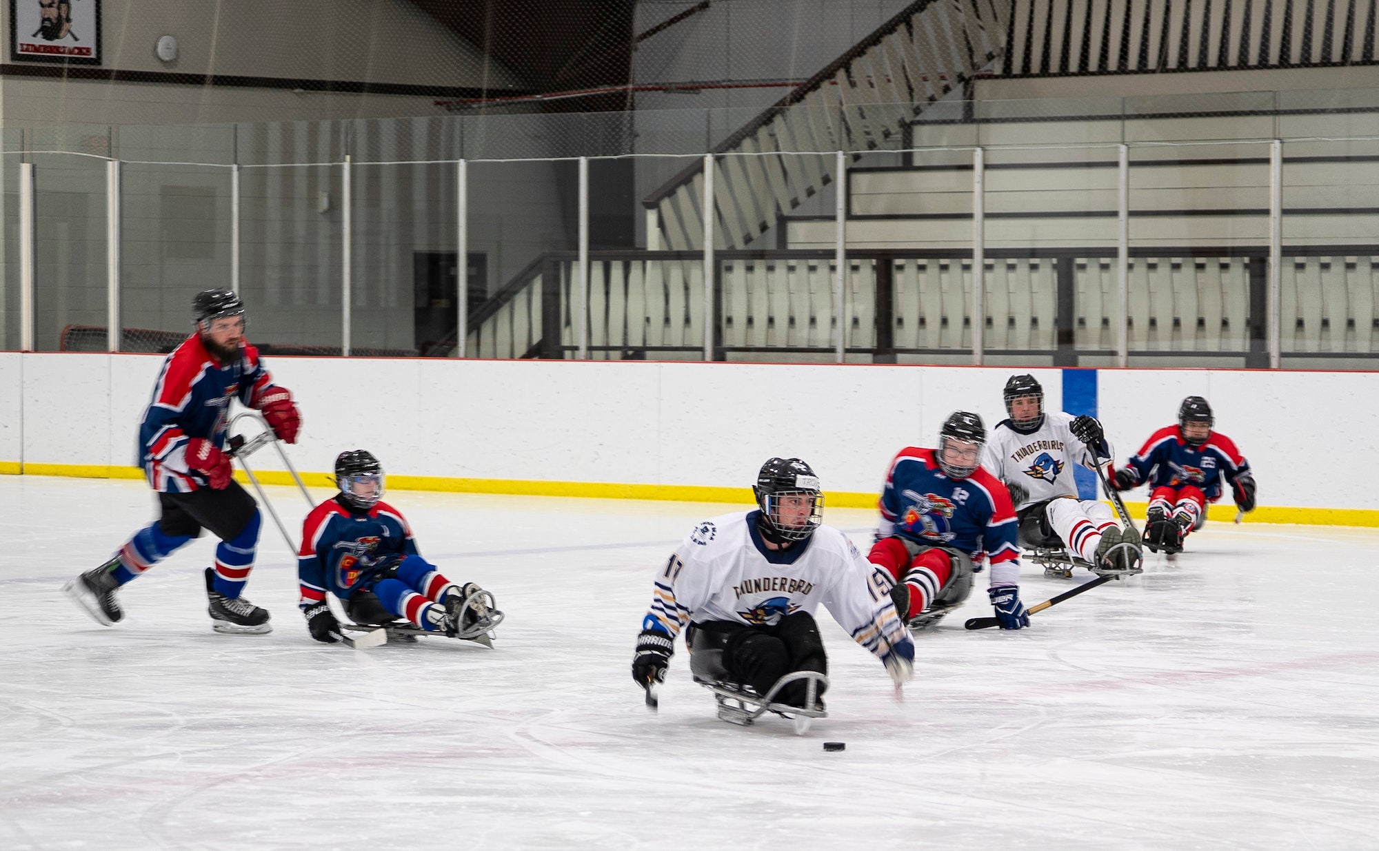 Adaptive ice hockey players on the ice at the Empire State Winter Games