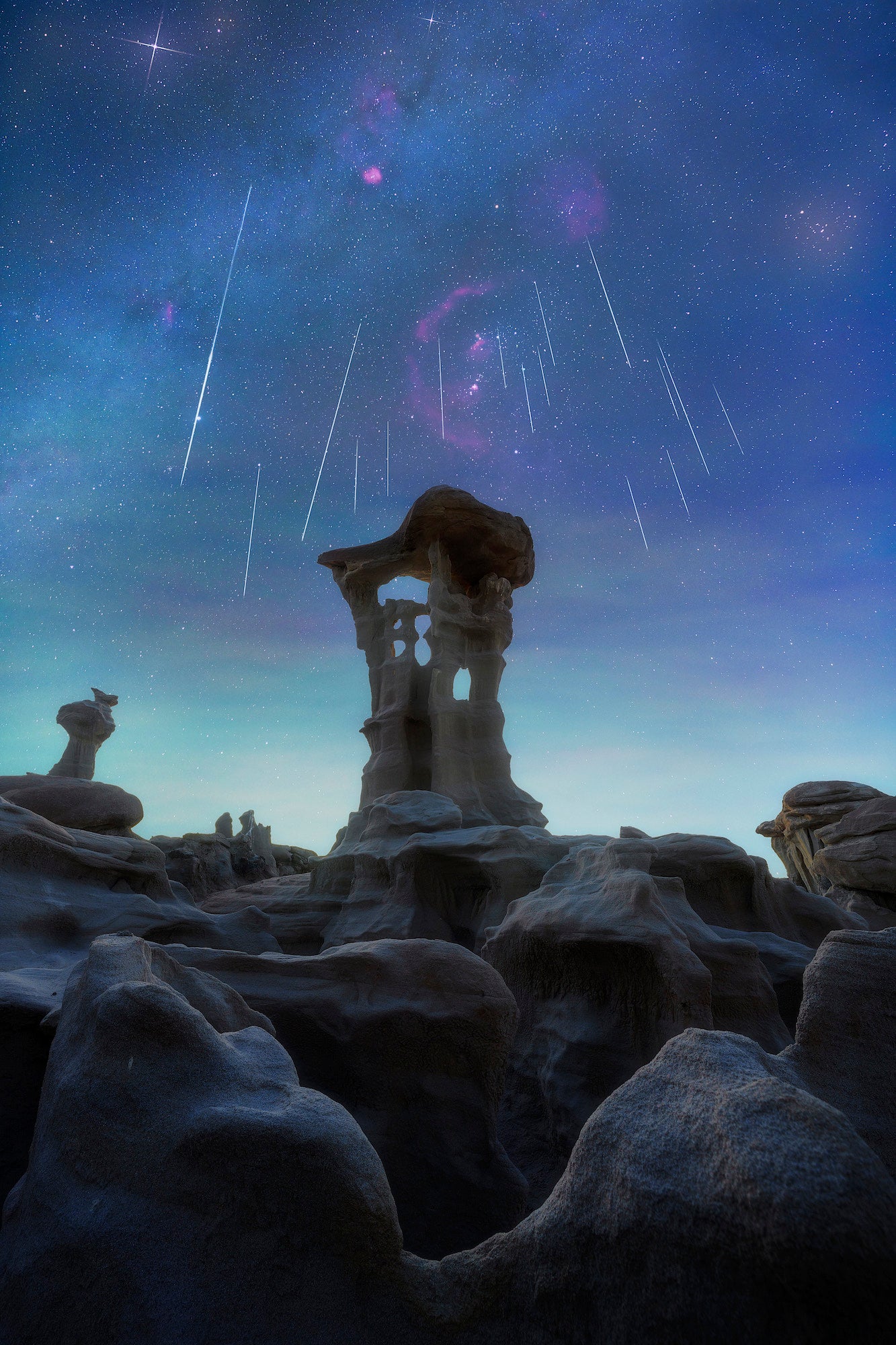 The Geminid meteor shower above the Alien Throne in New Mexico&rsquo;s remote Valley of Dreams.