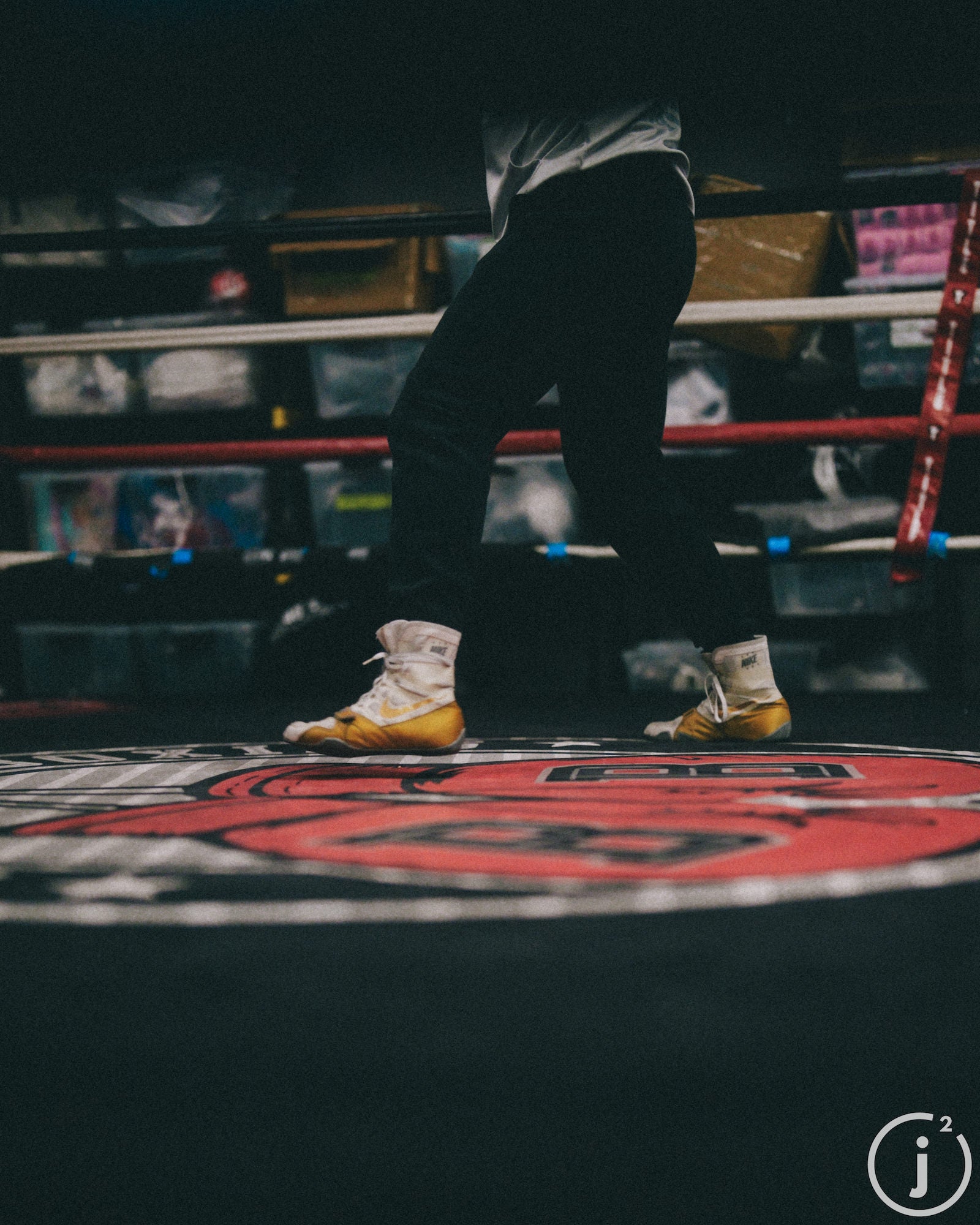 Close-up of boxer's feet and legs in the ring