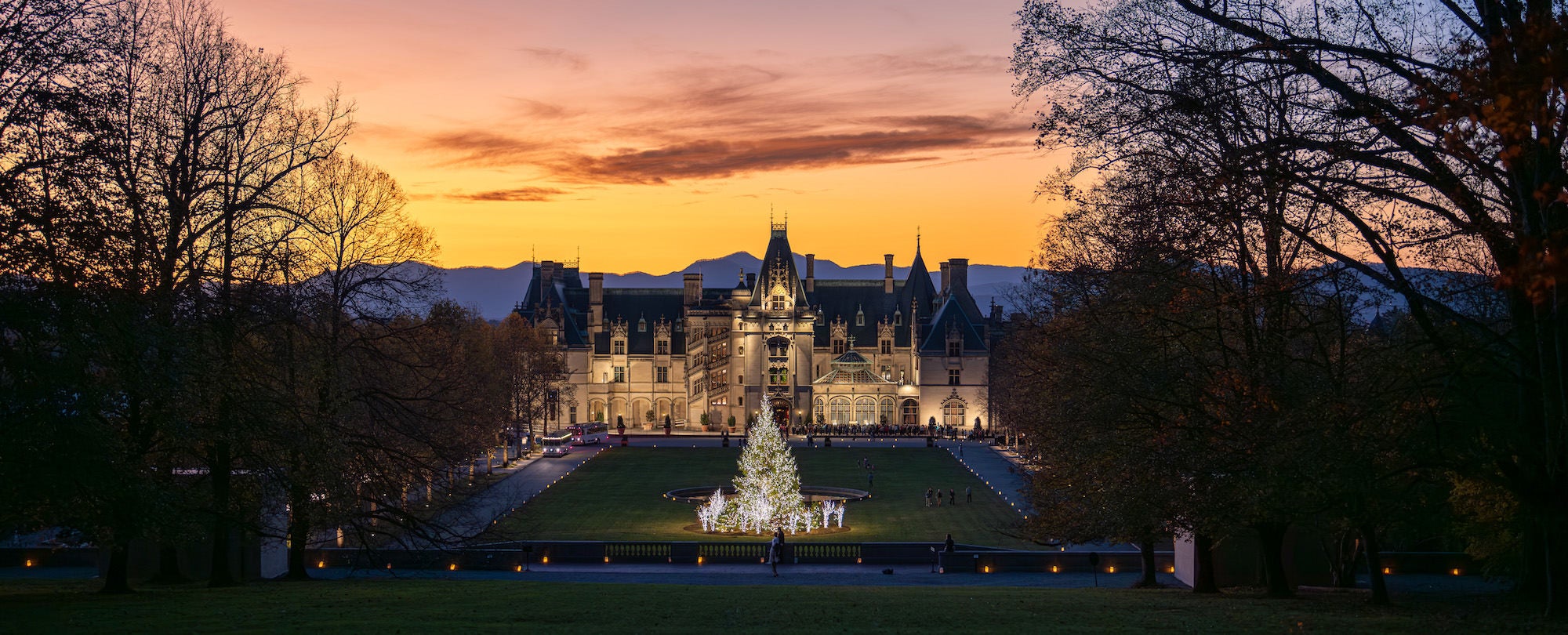 Panoramic sunset of Biltmore with illuminated holiday decorations