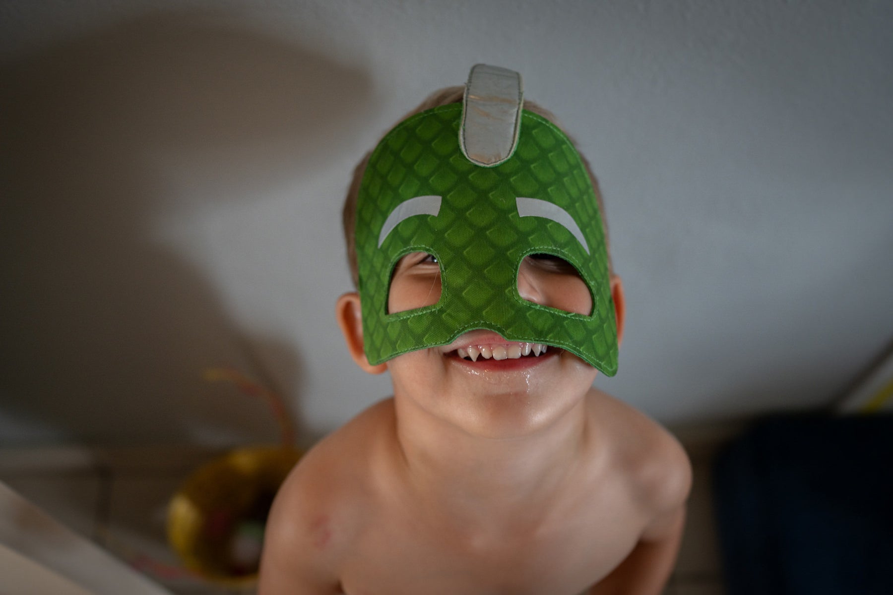 https://alphauniverseglobal.media.zestyio.com/kid-green-superhero-mask-smiling-closeup-portrait.jpg?height=1200&fit=bounds